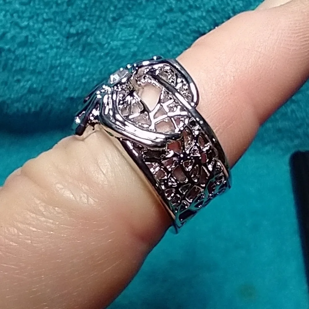 Silvertone spider web ring blue stone